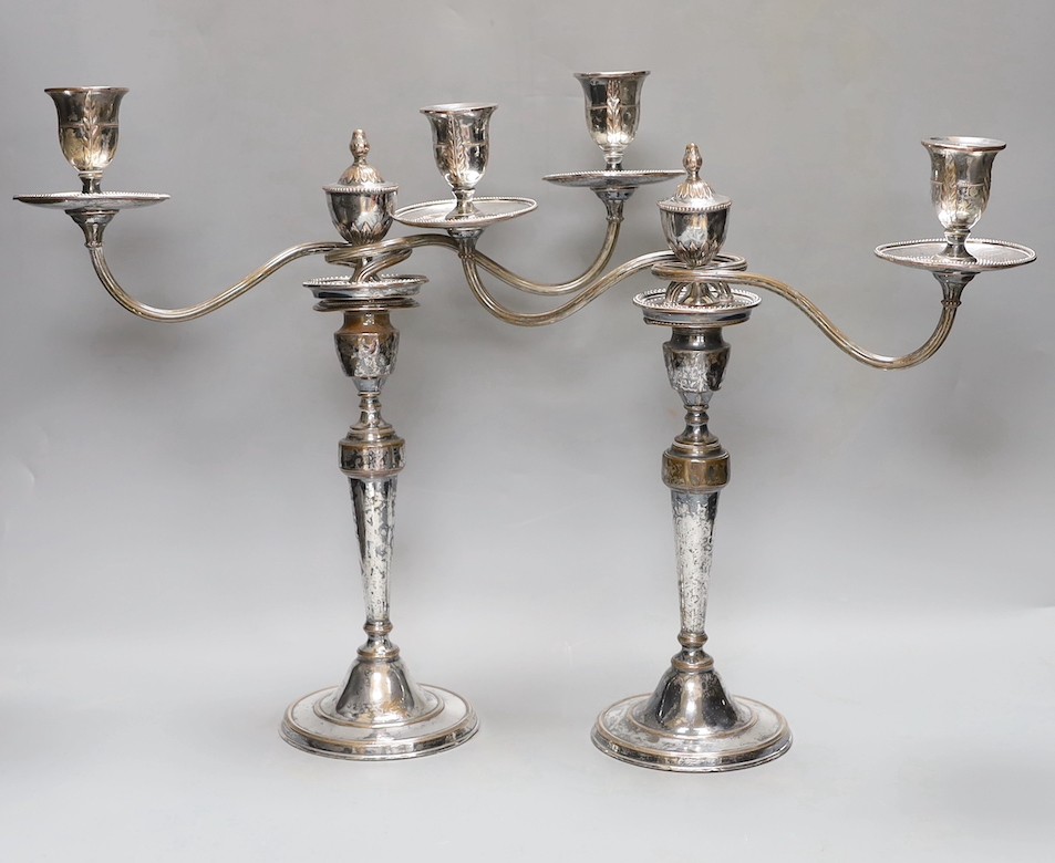 A pair of Sheffield plate two branch two light candelabrum, 37 cms high.